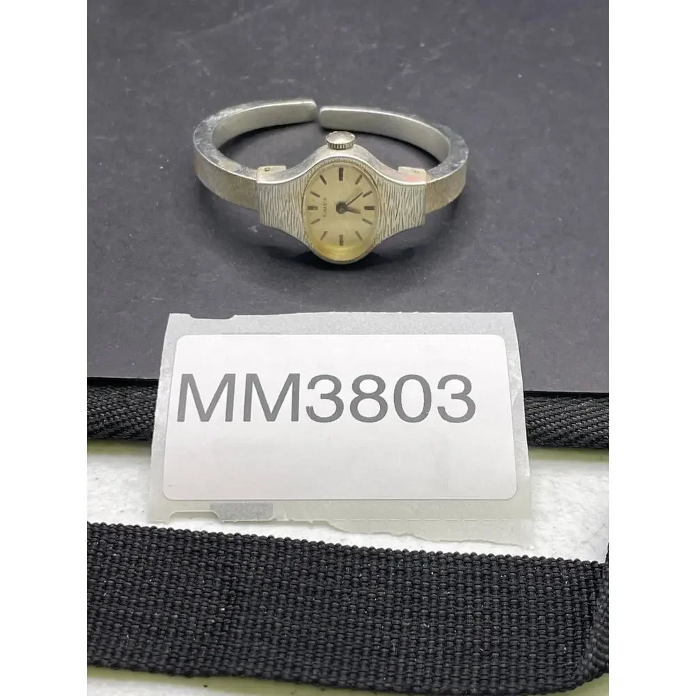 Vintage Timex Watch Women Silver Tone Oval Dial Cuff Band Manual Wind 20mm